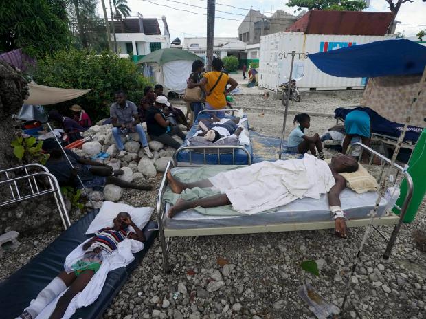 Injured people lie in beds outside the Immaculee Conception hospital in Les Cayes, Haiti (Photo: AP/PTI)