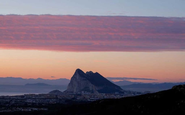 A general view of the Rock of Gibraltar landmark at dawn, on the first day of work following a post-Brexit deal, in La Linea de la Concepcion, Spain January 4, 2021. REUTERS